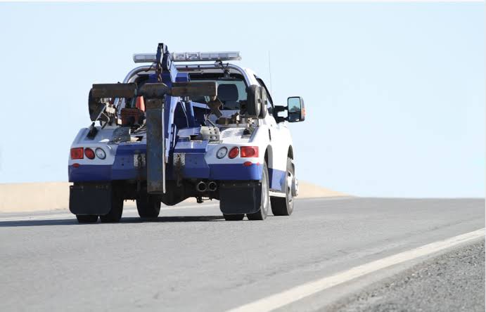 Tow truck on a highway shoulder